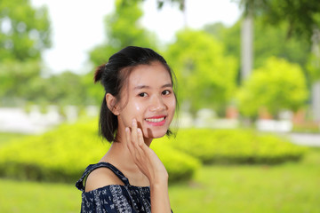 Fototapeta premium the face of young woman in bright background