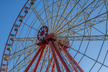 Ferris wheel on cloudy sky background amusement park carnival