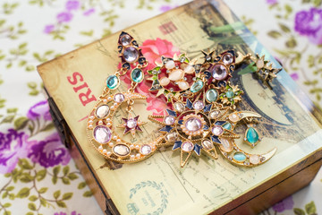 Vintage beads crystals and pearls with box and textile background
