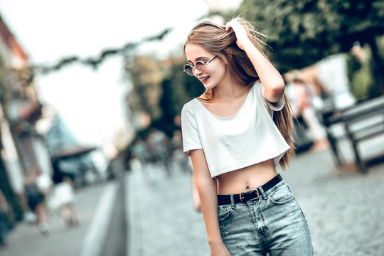Lifestyle fashion concept.Young beautiful stylish woman walking in the street.