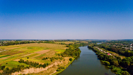 Fototapeta na wymiar Aerial view of the river field and village.