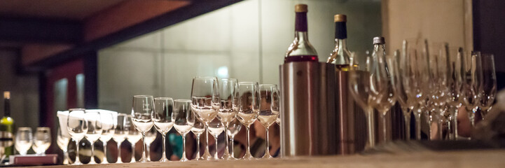 Various wines and glasses prepared in the wine cellar. Various wine tastings