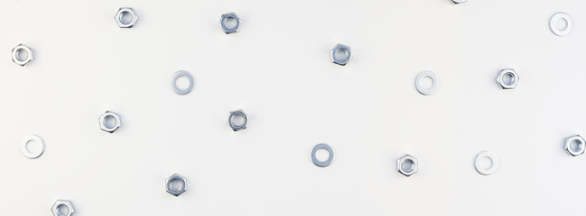 Flat lay of metal nuts on white background