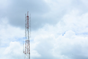 Cellular antenna against blue sky in summer