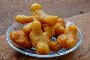 soybean milk and deep-fried dough stick on wood background, Thai style breakfast