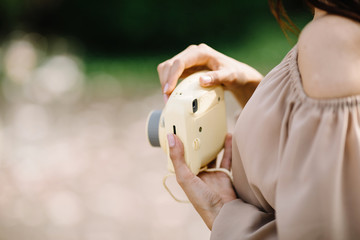 Close up Portrait of beautiful woman with nstax camera. 