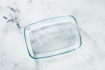 Glass pan for baking on a marble table