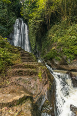 Fototapeta na wymiar Yellow waterfall en la isla de Bali, Indonesia.