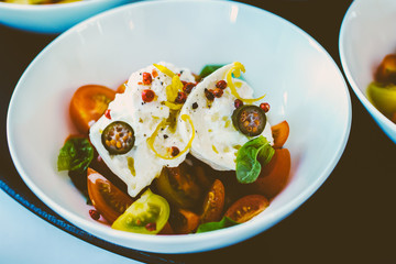 luxurious cuisine starter with buratta tomato lemon and jalapeno soft filter delicious food