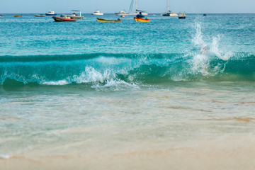 Waves and boats on ocean