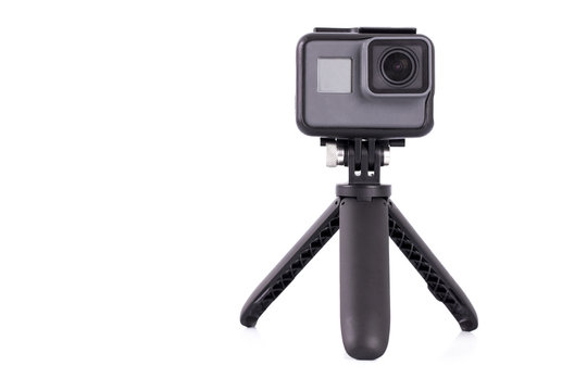The action camera on tripod isolated on white background