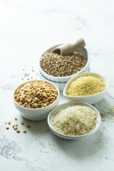 Assorted grains in the white bowls