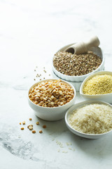 Assorted grains in the white bowls