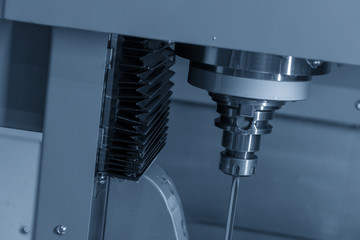 The vertical CNC gun-drill machine drilling the mold part .The Hi-Technology mold manufacturing process.