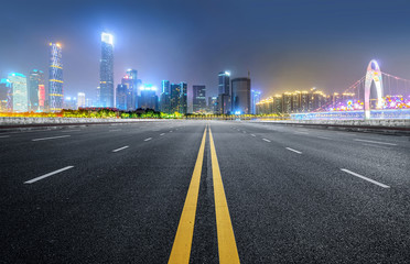 Fototapeta na wymiar Empty road floor surface with modern city landmark buildings of guangzhou bund Skyline