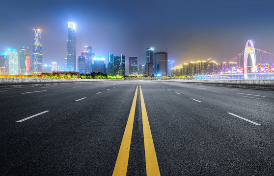 Empty road floor surface with modern city landmark buildings of guangzhou bund Skyline