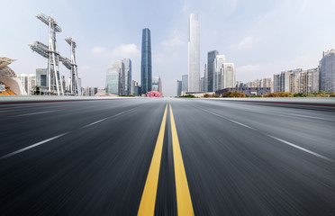 Empty road floor surface with modern city landmark buildings of guangzhou bund Skyline