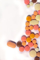 Colored drugs for oral use on white background