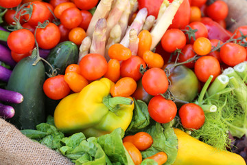 tomatoes and more fresh vegetables for sale at local market