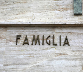 text FAMIGLIA that means Family in Italian Language
