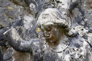 Fototapeta na wymiar Angel sculpture in a graveyard