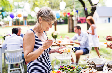 Family celebration or a garden party outside in the backyard.