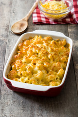 Typical American macaroni and cheese on wooden table