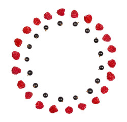 Round frame made of raspberry and black currant isolated on white background. Top view. Flat lay.