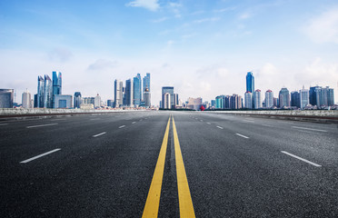 Fototapeta premium The expressway and the modern city skyline are in qingdao, China.