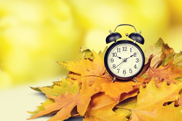Retro alarm clock on table  background