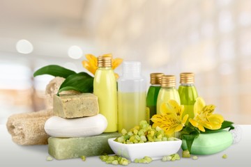 Fototapeta na wymiar Bottles with organic essential aroma oils on background