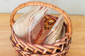A lot of Russian money in denominations of five thousand rubles are in the basket