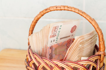 A lot of Russian money in denominations of five thousand rubles are in the basket