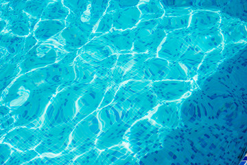 Bright blue surface swimming pool water background