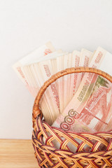 A lot of Russian money in denominations of five thousand rubles are in the basket - obrazy, fototapety, plakaty