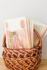 A lot of Russian money in denominations of five thousand rubles are in the basket