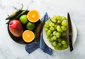 colored vegetables and fruits on the table. preparation of morning juices. healthy eating