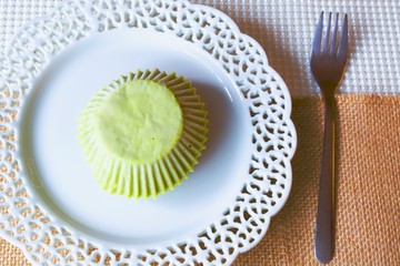  Tasty colourful cashew cupcake on the white plate