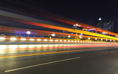 Fototapeta na wymiar abstract image of blur motion of cars on the city road at night，Modern urban architecture in guangzhou, China
