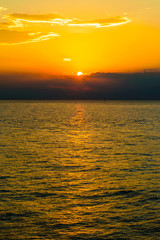 Orange skies as the sun sets over the Hudson River in New York City. Copy Space for Text.