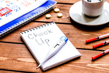 concept time health check up on wooden background