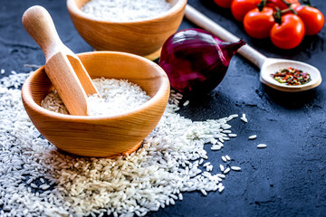 ingredients for paella on dark background