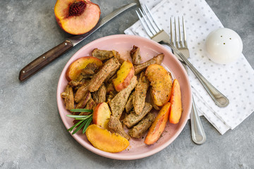 Pork meat with peach.