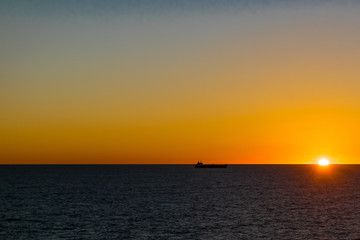 Naklejka na ściany i meble Sunrise on the Atlantic Ocean near the east coast of Canada.