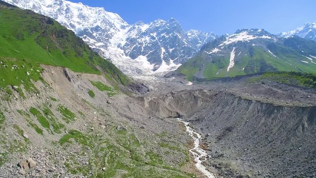 river flows out of the Shkhara Glacier aerial view