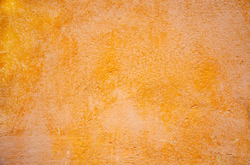 old shabby concrete wall of orange color