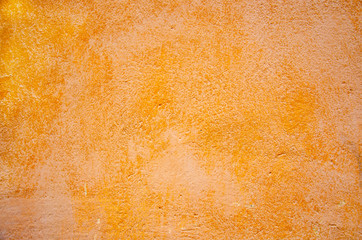 old shabby concrete wall of orange color