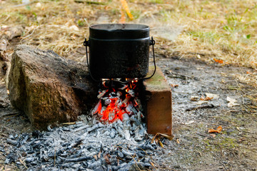 Cooking on campfire in camping