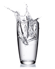 Water splash out of glass isolated on white background.