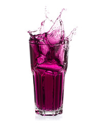 Grape juice splash out of glass isolated on white background.